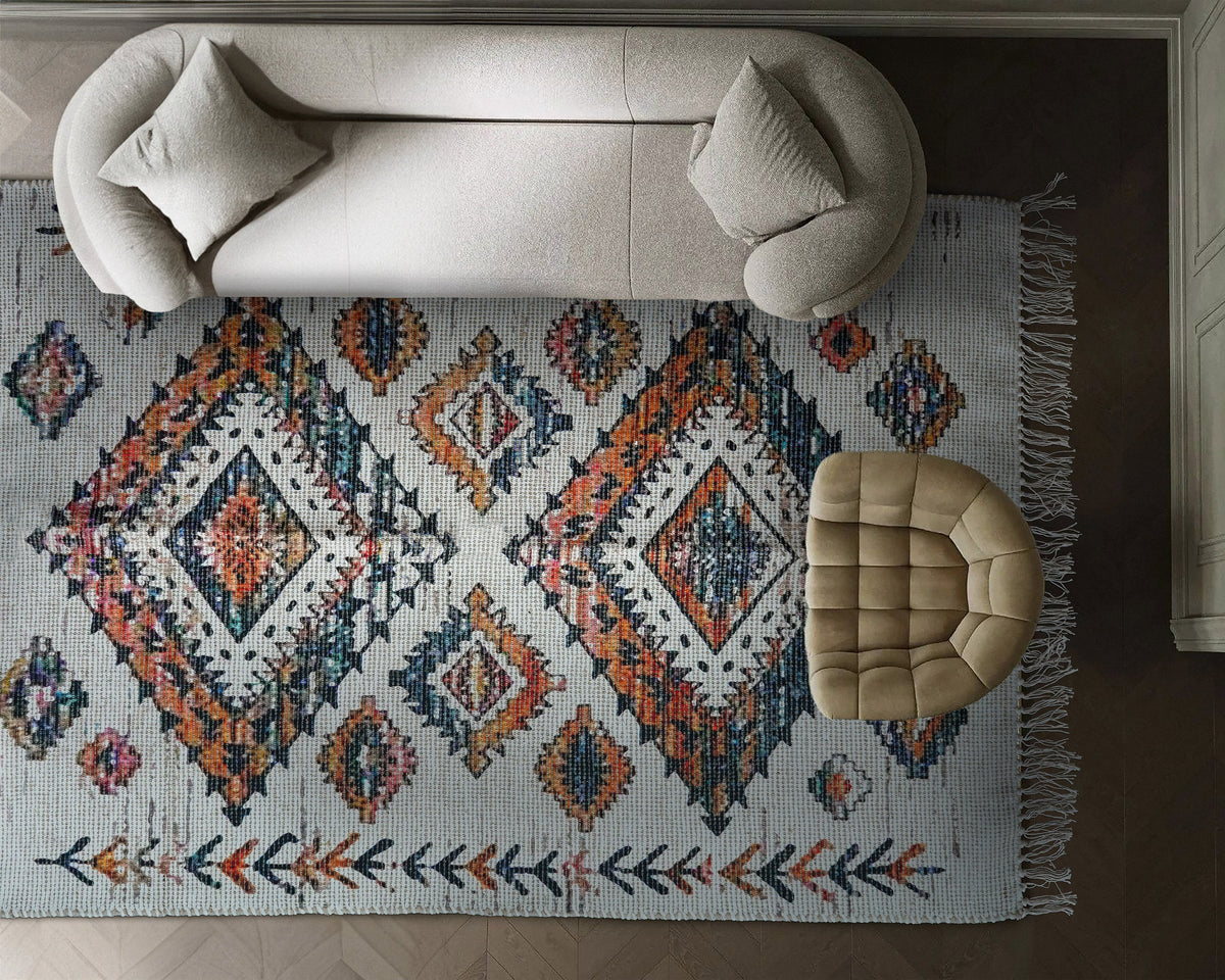 Off white jute rug styled in a bedroom