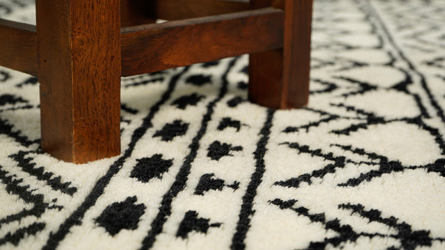 Ivory Berber wool rug styled in a modern living room