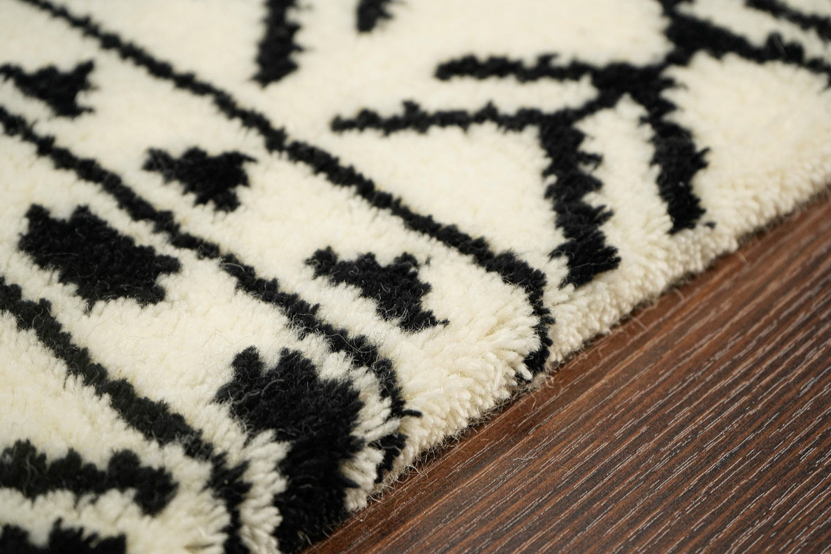 Wide shot of ivory Berber rug in a bright room