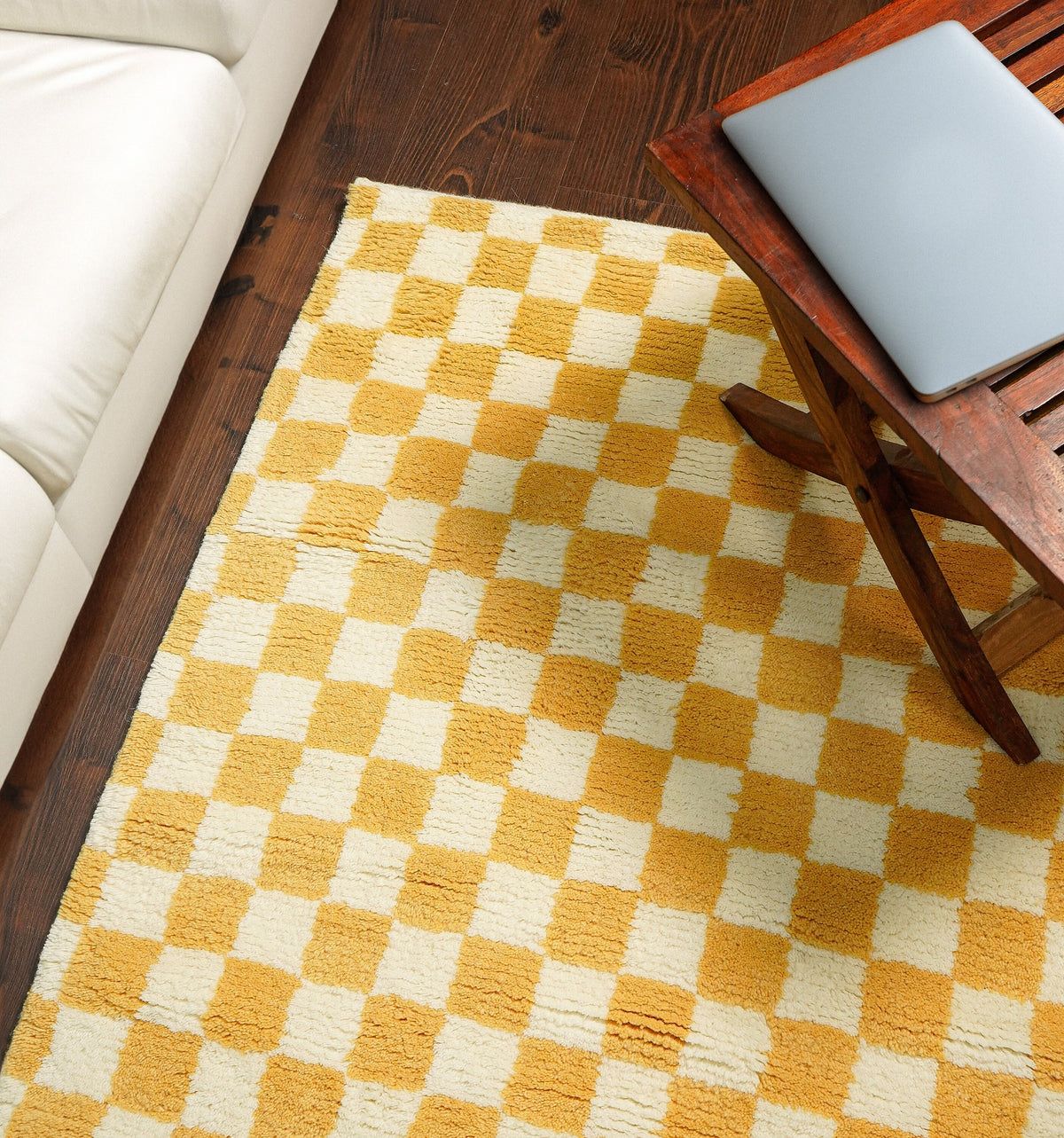 Yellow checkered wool rug flat lay