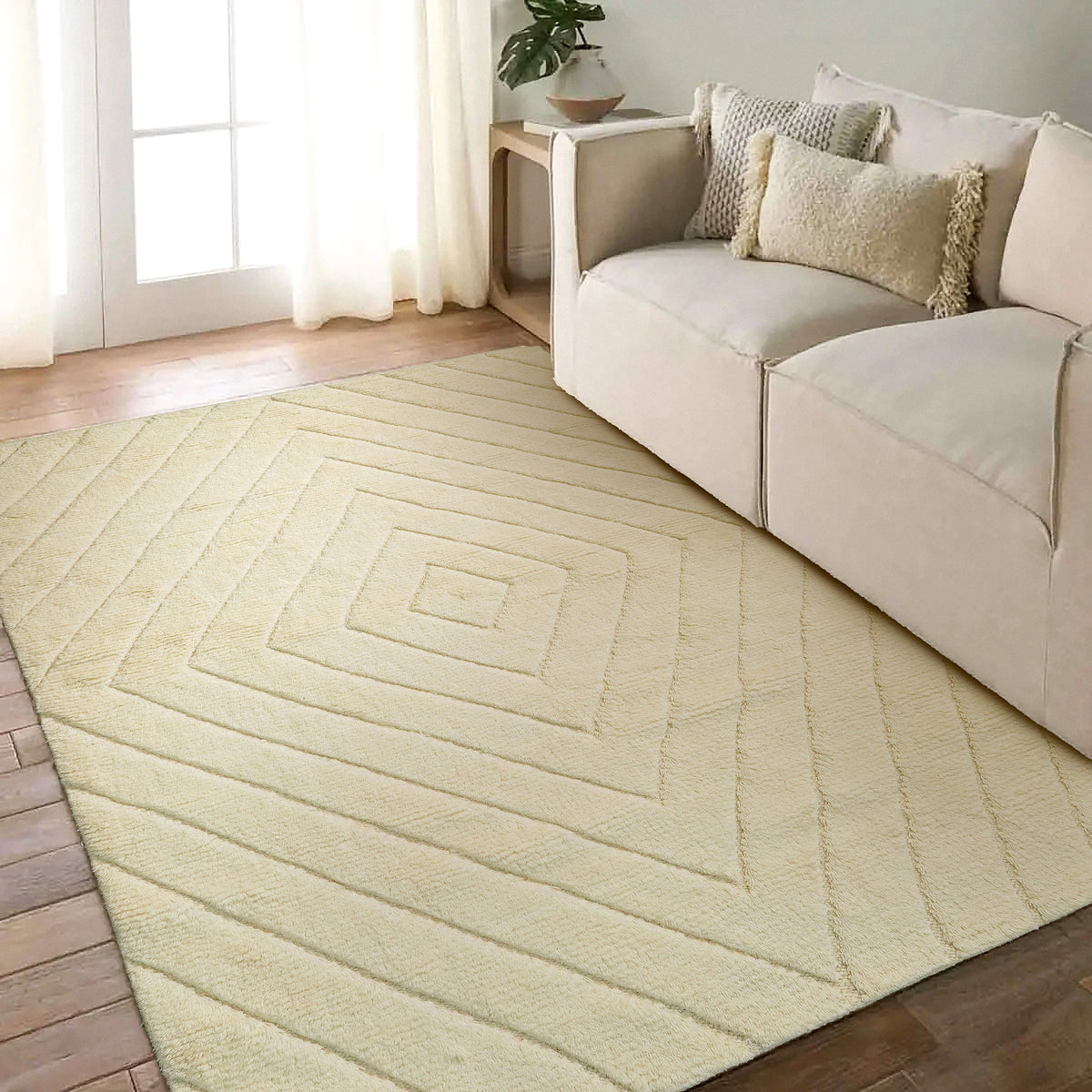 Ivory abstract wool rug under a coffee table