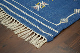 Blue Aztec rug under a coffee table lifestyle shot
