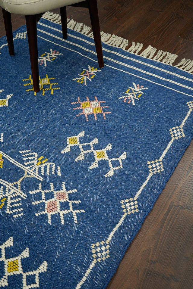 Blue Aztec kilim rug, flat lay view