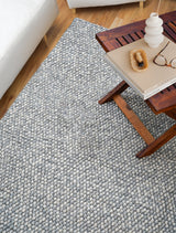 Grey chunky looped wool rug flat view