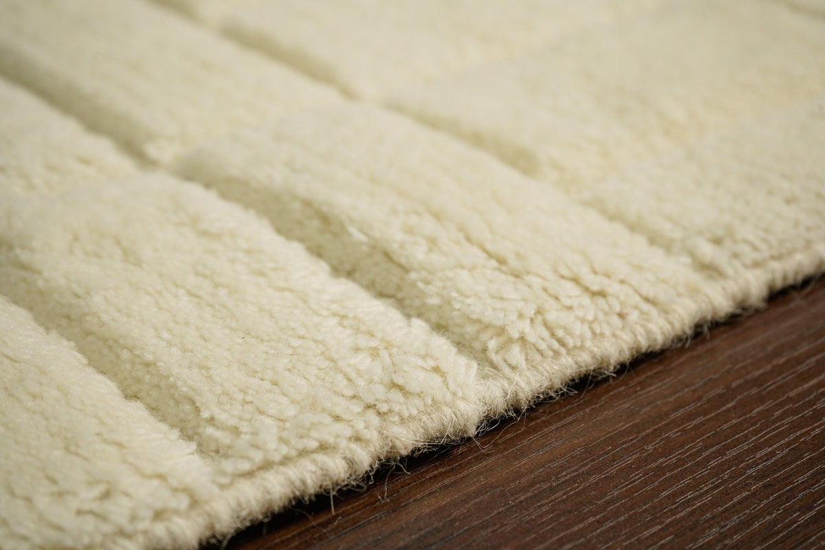 Ivory abstract rug styled with neutral furniture