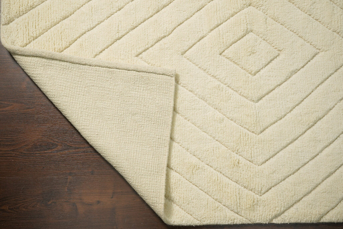 Ivory wool rug texture close-up showing pile