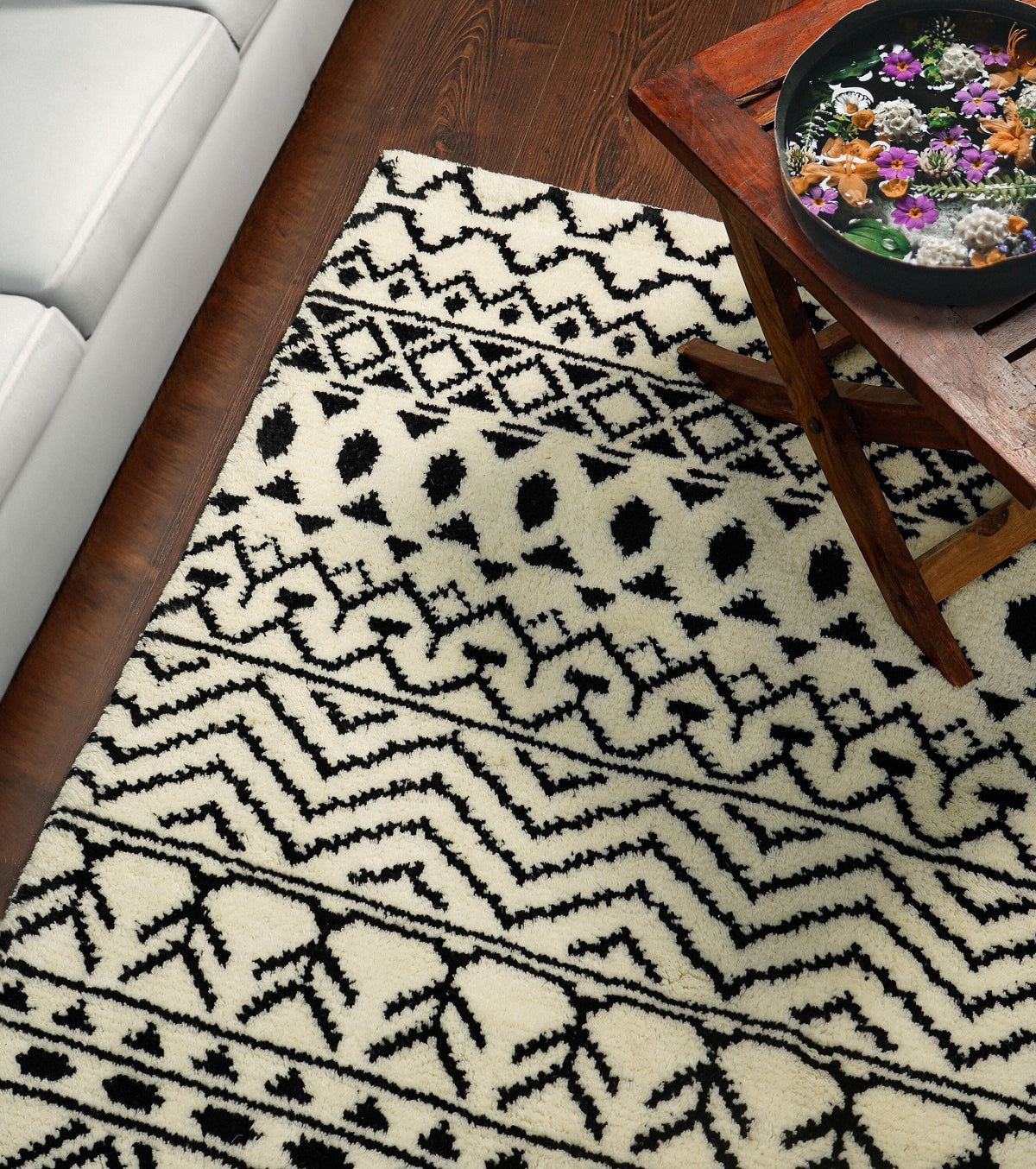 Close-up of hand-knotted wool pile texture on ivory rug