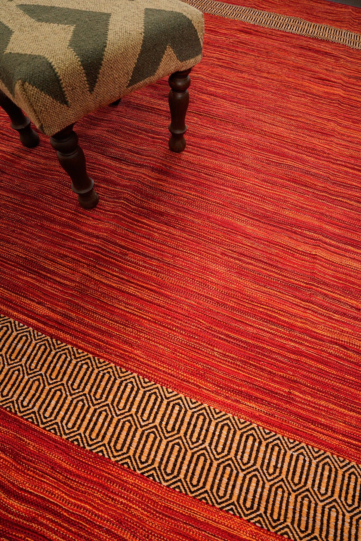 Red kilim rug styled in a living room setting