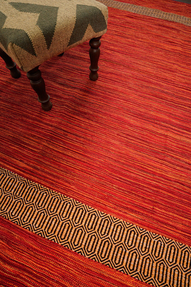 Red kilim rug styled in a living room setting