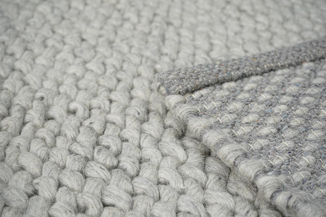Wool rug styled in a Scandinavian living room