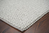Pile close-up showing looped wool fibers