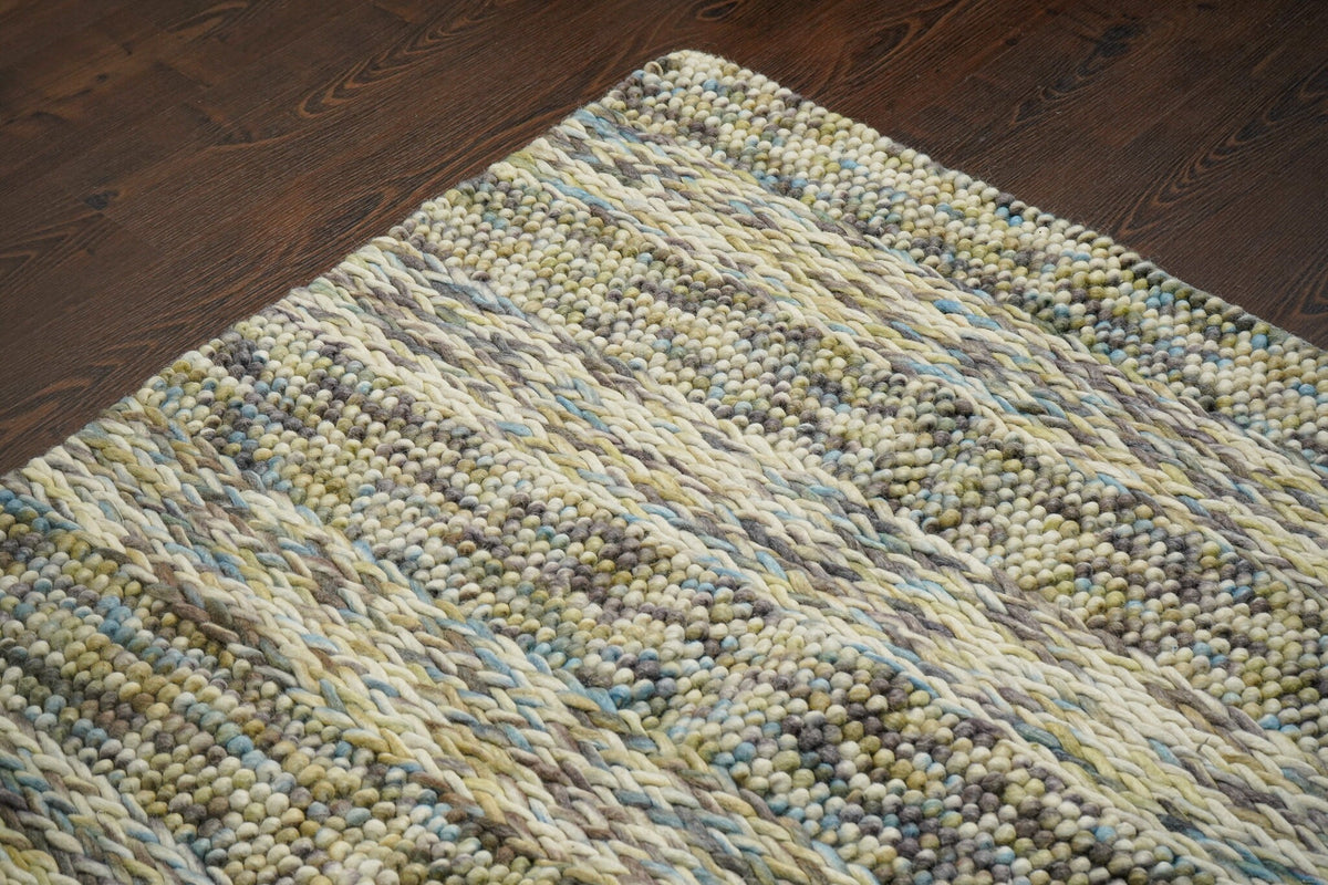 Handwoven multi colour wool rug texture close-up