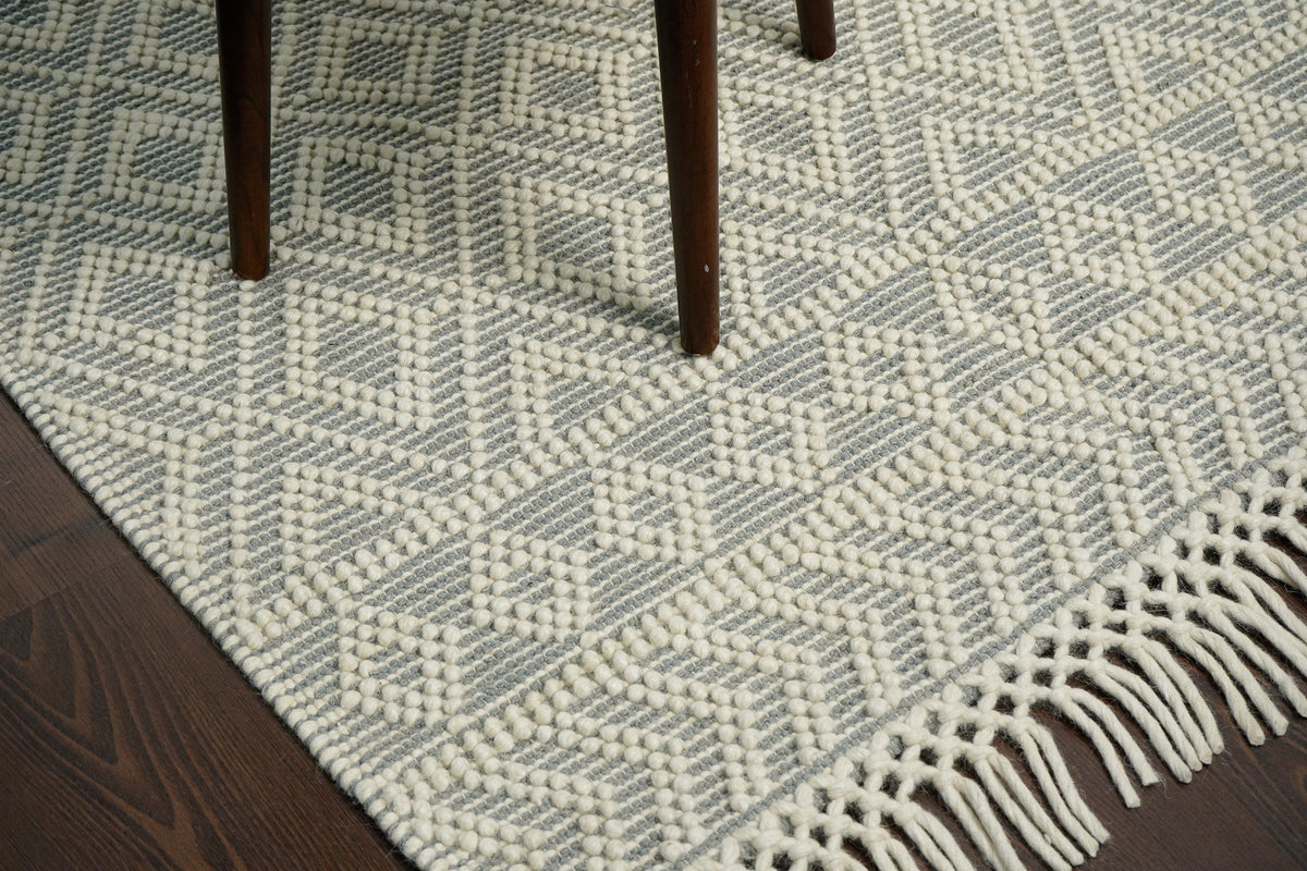 Handwoven diamond loop wool rug texture close-up