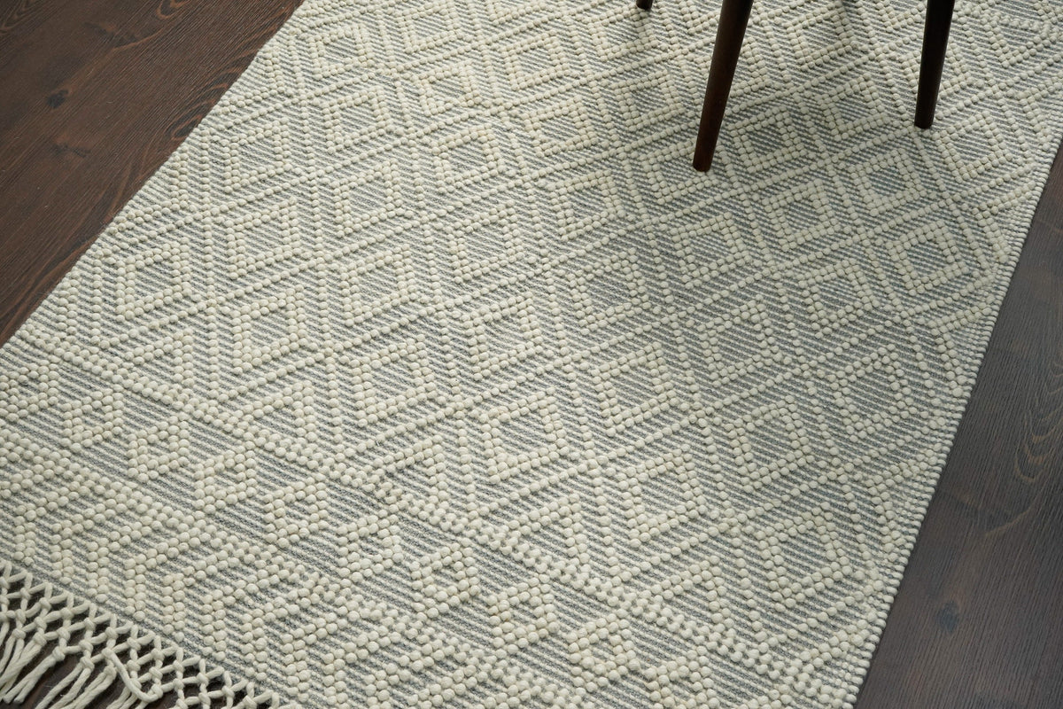 Diamond loop wool rug styled in a living room