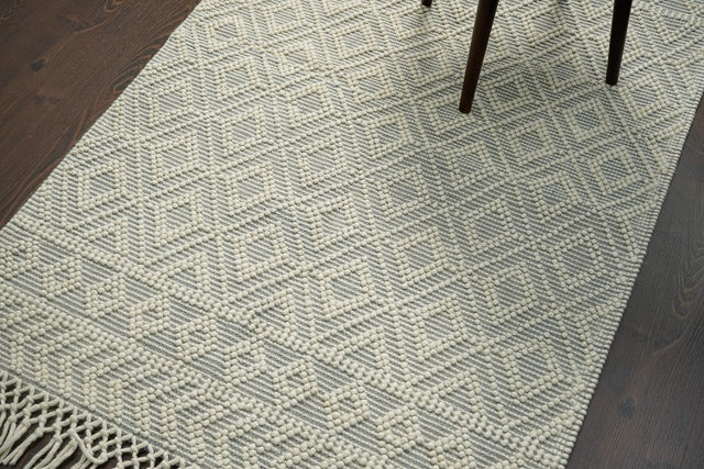 Diamond loop wool rug styled in a living room