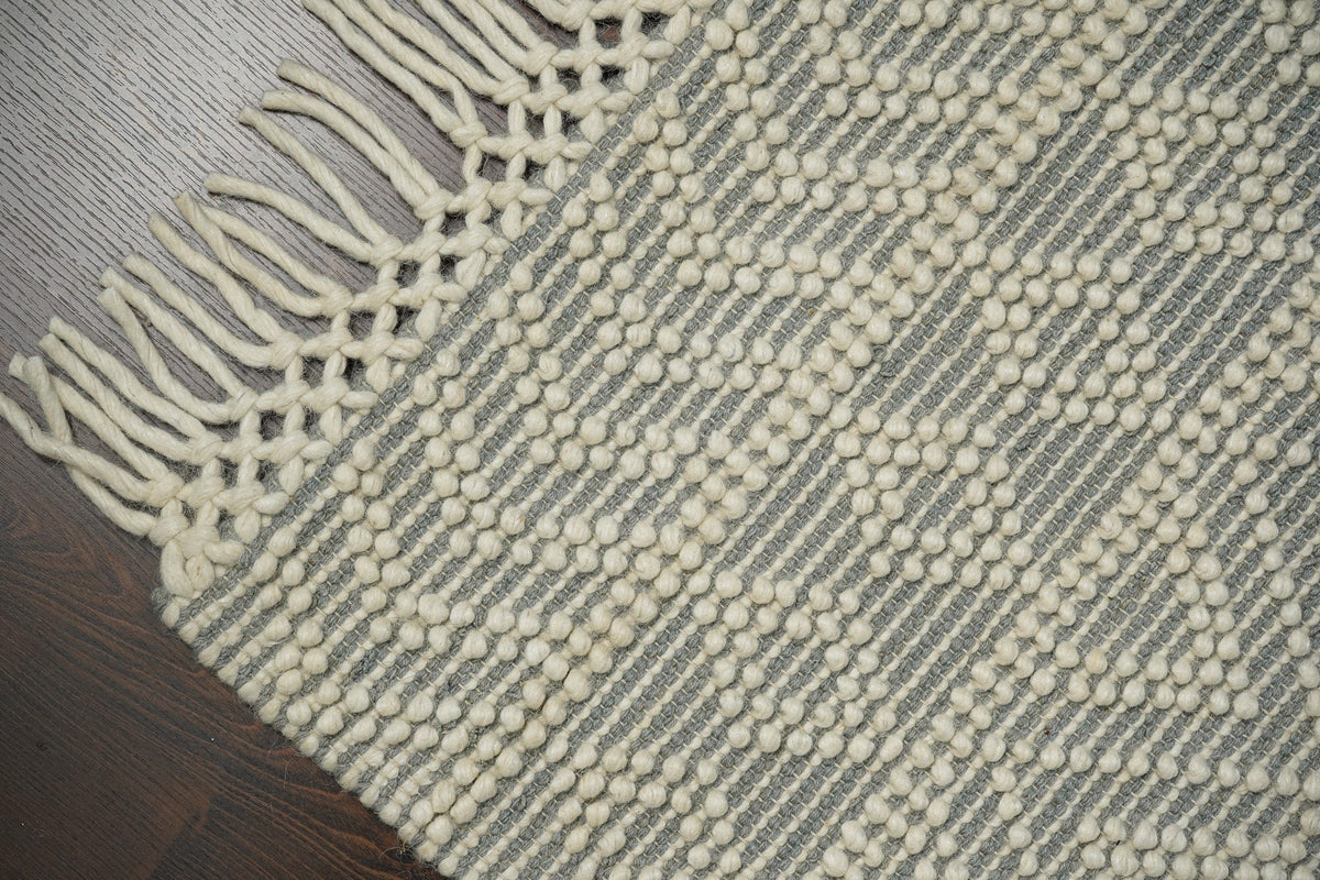 Diamond loop wool rug in a bedroom setting