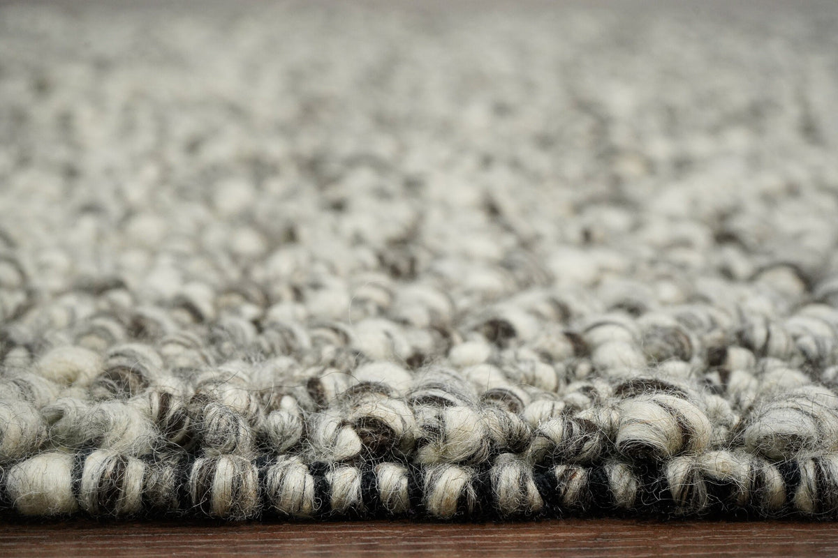 Grey rug styled in hallway