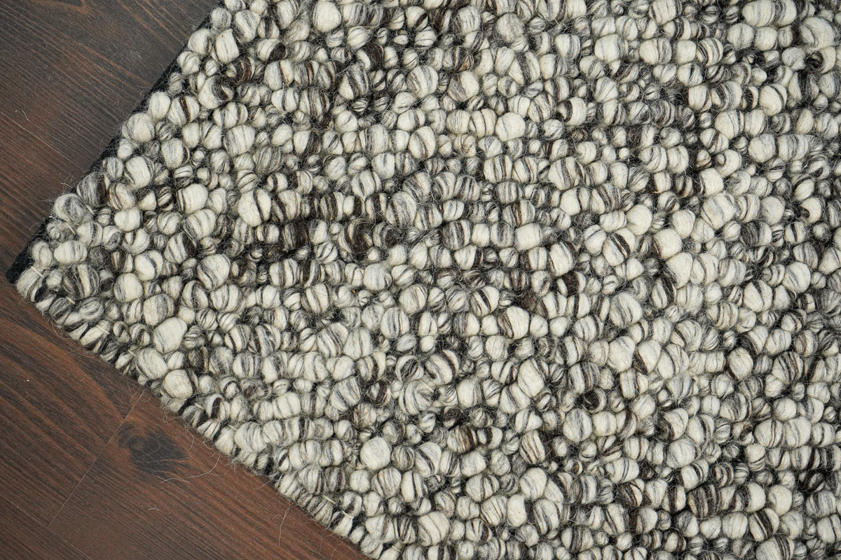 Grey chunky loop wool rug, flat lay view