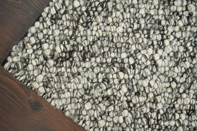 Grey chunky loop wool rug, flat lay view