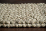Beige chunky rug styled in a living room
