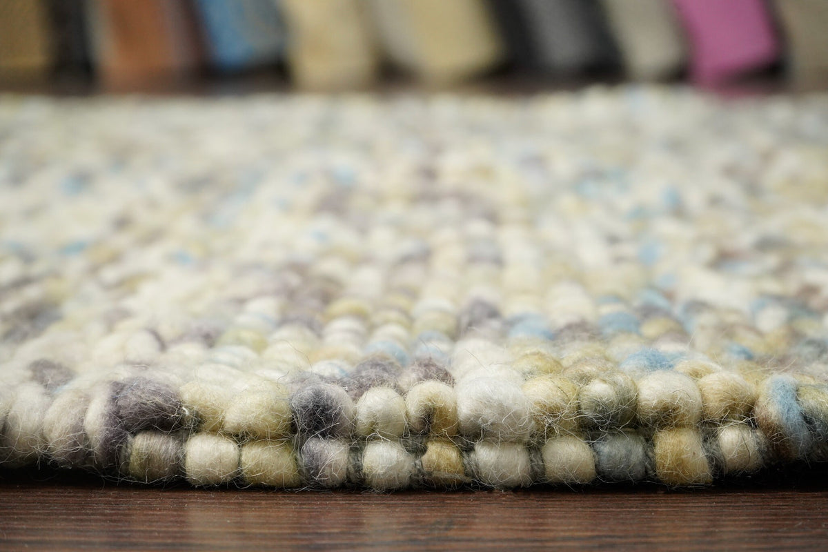 Multi colour wool rug styled with furniture