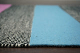 Rainbow wool rug under furniture in living space