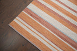 Full flat lay of striped orange kilim rug