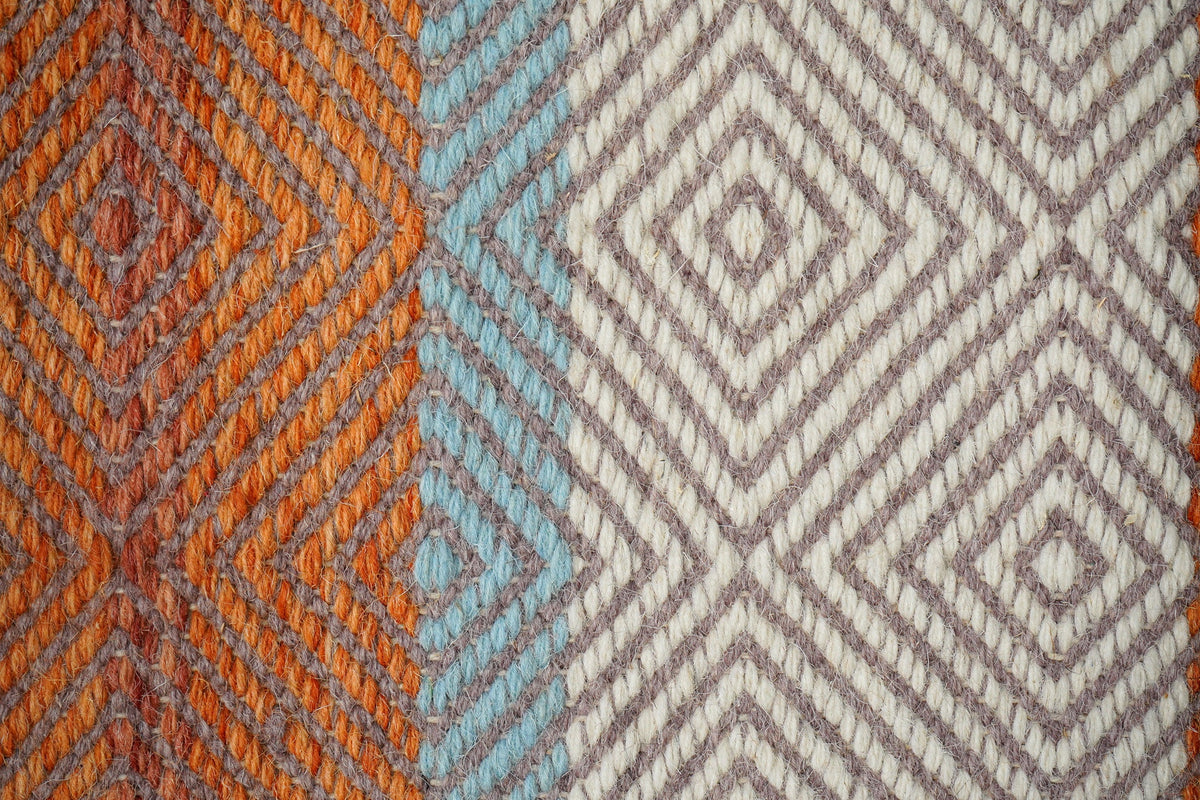 Orange kilim rug in bohemian styled room
