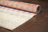 Beige striped rug in natural light