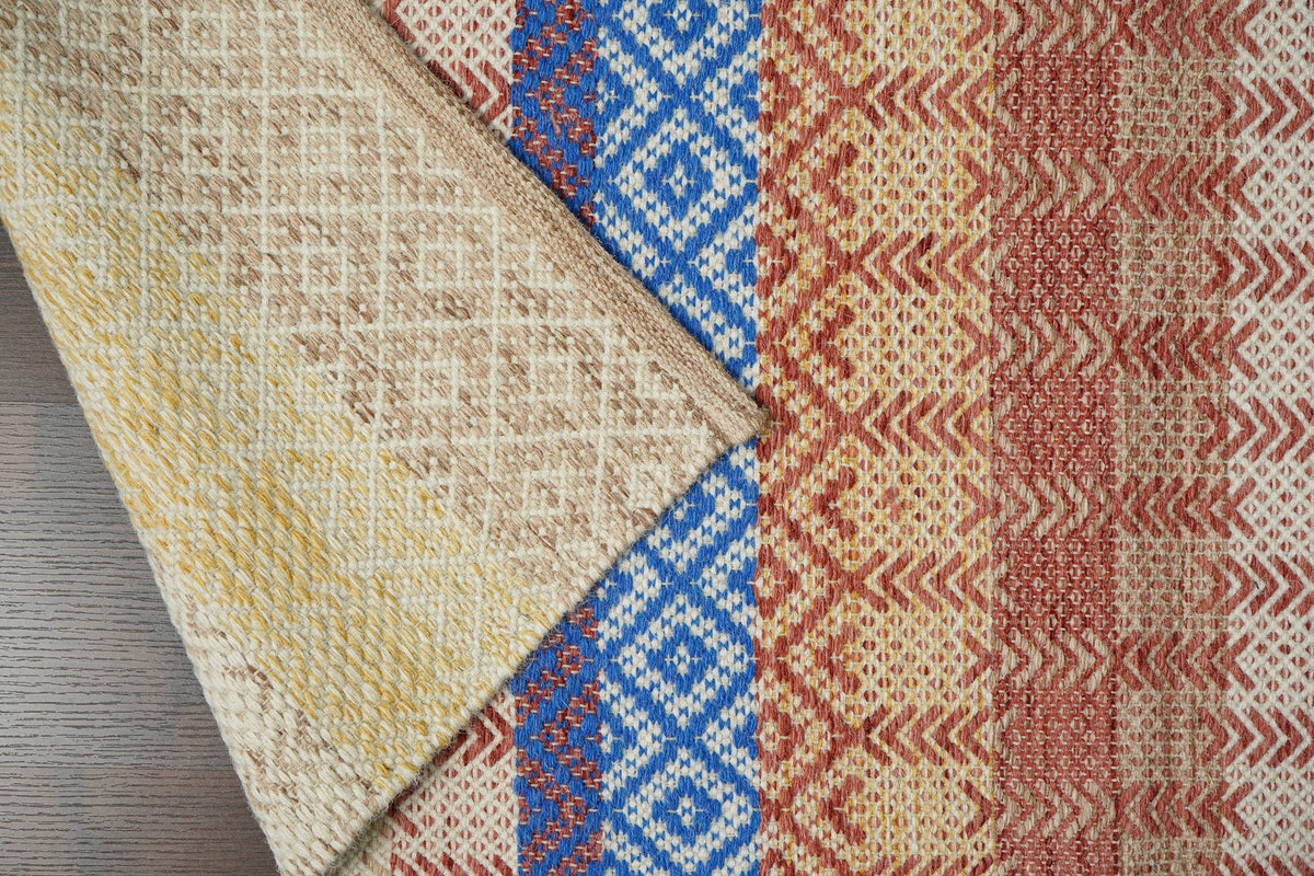 Beige striped flatweave wool rug flat lay