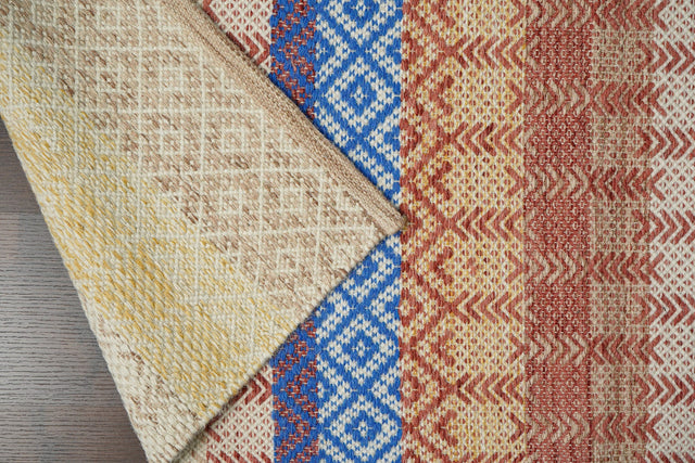 Beige striped flatweave wool rug flat lay