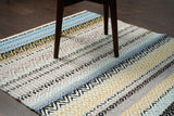 Striped kilim rug styled near a sofa