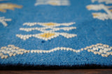 Close-up of blue patio rug fringe and weave