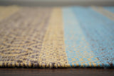 Wool flatweave rug placed under living room furniture