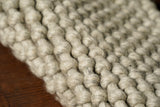 Chunky grey wool rug in a Scandinavian styled room