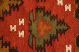 Southwestern red kilim rug in a bohemian bedroom
