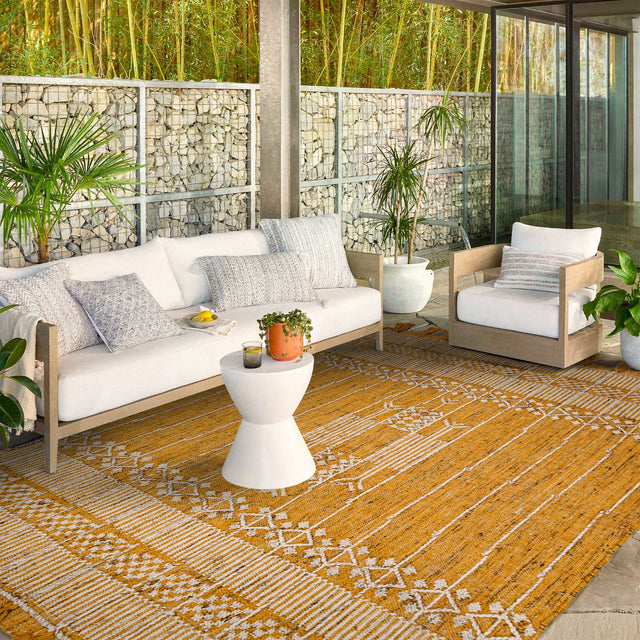 Yellow tribal rug styled on a patio