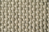 Close-up of chunky wool loop pile texture