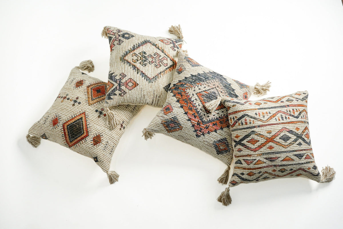 Bohemian ivory cushion set flat lay showing all four covers