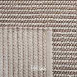 Ivory wool rug styled in a Scandinavian living room