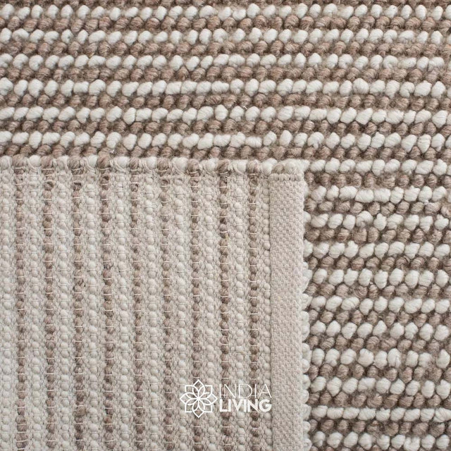 Ivory wool rug styled in a Scandinavian living room