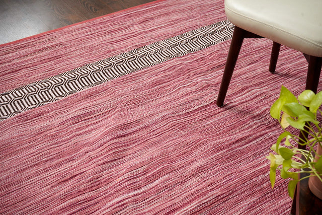 Pink cotton chenille rug styled in a living room