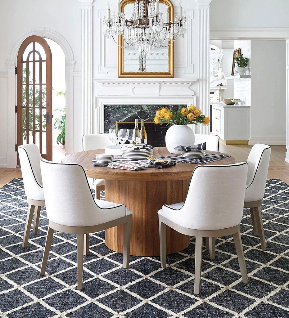 Black jute rug styled in a modern living room
