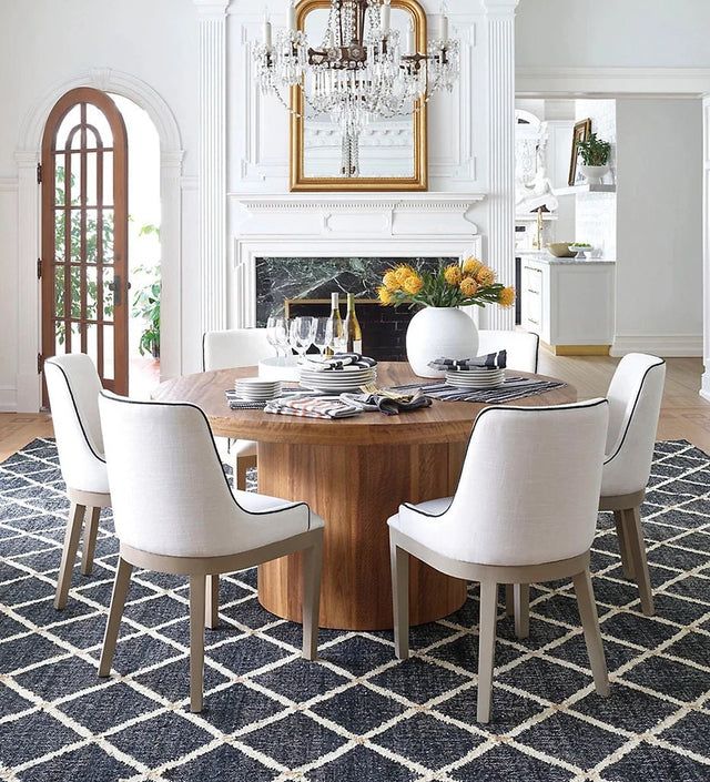 Black jute rug styled in a modern living room