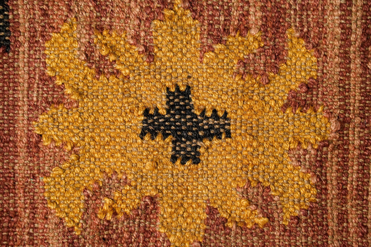 Kilim rug styled beside furniture