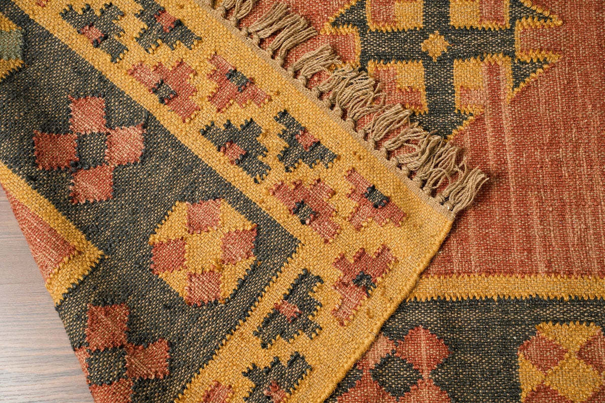 Orange kilim rug in southwestern styled room