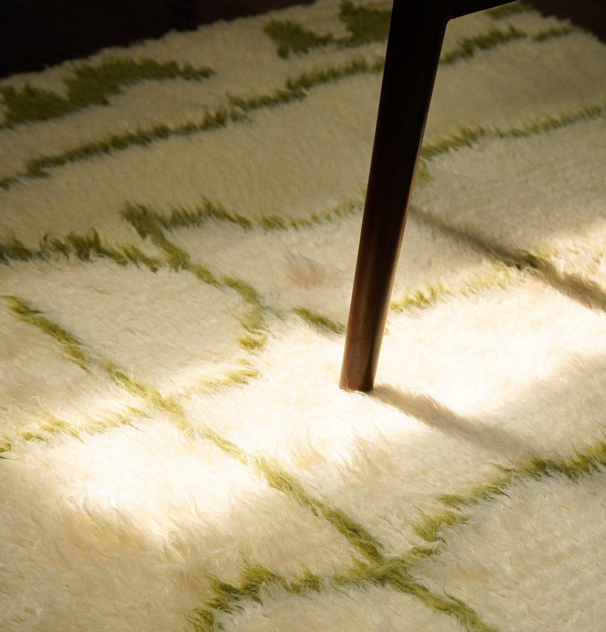 Green Berber rug corner detail