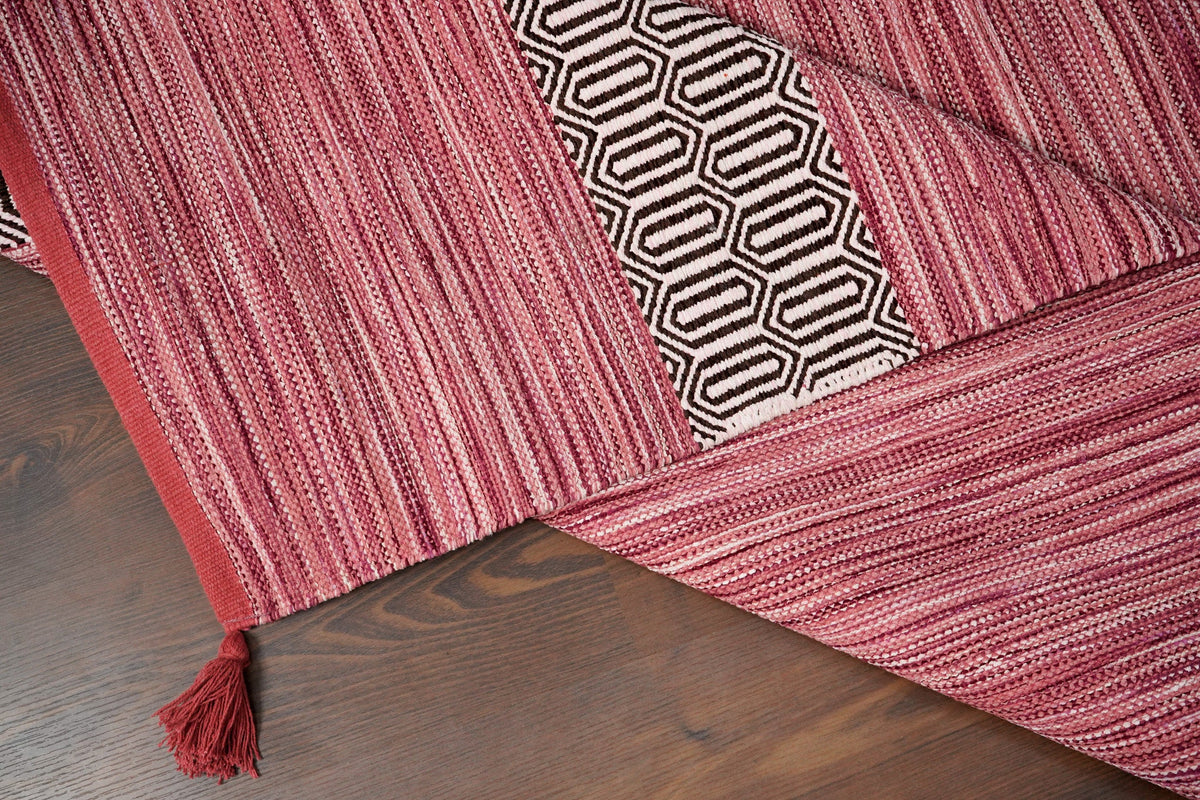 Pink rug styled with Moroccan-inspired home decor accents