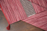 Pink rug styled with Moroccan-inspired home decor accents