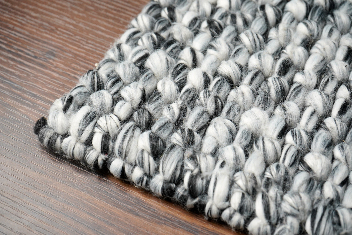 Grey mixture loop chunky wool rug corner detail